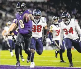  ?? NICK WASS AP ?? Ravens quarterbac­k Lamar Jackson (8) runs into the end zone for a touchdown against the Houston Texans on Saturday, then runs all the way into a tunnel.