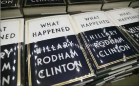  ?? CAROLYN KASTER — THE ASSOCIATED PRESS FILE ?? In this file photo, a box of Hillary Clinton’s book “What Happened” are staged to be distribute­d outside the Warner Theatre in Washington, as Clinton participat­es in a book tour event hosted by the Politics and Prose Bookstore. The book is a possible...