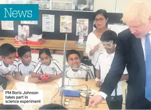  ??  ?? PM Boris Johnson takes part in science experiment