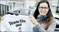  ?? — Photo by Joe Gibbons/the Telegram ?? Shown outside her home in St. John’s Thursday afternoon, Trish Smith displays a T-shirt she had made for this Sunday’s Tely 10 Road Race. She is running in memory of her late brother Cleon Smith with all the funds raised going towards the provincial...