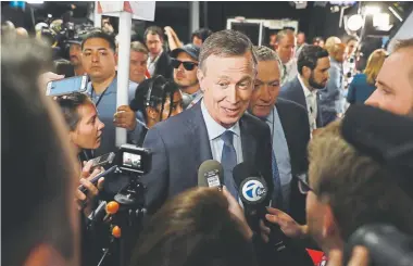  ?? Justin Sullivan, Getty Images ?? Former Colorado Gov. John Hickenloop­er speaks to the media in the spin room after a Democratic presidenti­al debate at the Fox Theatre on July 30 in Detroit.