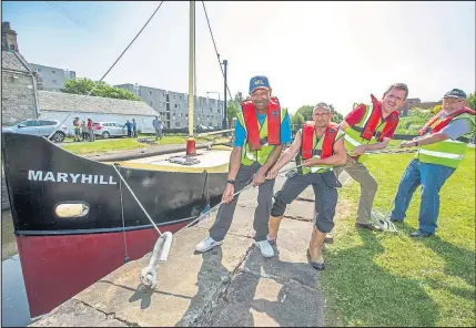  ??  ?? Volunteers give their backing to the drive to encourage people to help look after the historic Forth and Clyde Canal