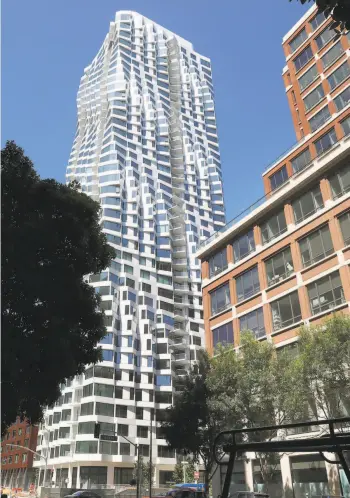  ?? Liz Hafalia / The Chronicle ?? The 39story Mira tower at the corner of Folsom and Spear streets, designed by Jeanne Gang, resembles a gleaming corkscrew with a flat top. More than 150 of its 392 units are affordable.