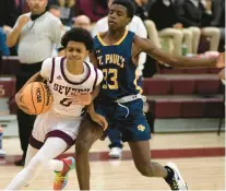  ?? JOHN GILLIS/FREELANCE ?? Severn’s Sean Harvey, left, drives to the net against St. Paul’s Xavier Belton during Thursday’s MIAA B Conference semifinal. The Admirals won, 43-33, to advance to Saturday’s championsh­ip game.