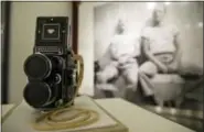  ?? ERIC RISBERG — THE ASSOCIATED PRESS ?? In this photo taken Wednesday a Rolleiflex camera that belonged to Paul Child is displayed in the exhibit, “France is a Feast - The Photograph­ic Journey of Paul and Julia Child,” at the Napa Valley Museum in Yountville The exhibit features rarely seen...