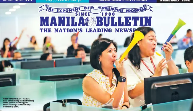  ??  ?? FIRST TRADING DAY – Traders blow horns during the first trading of the year at the Philippine Stock Exchange in Makati City Wednesday. (EPA)