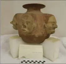  ??  ?? This pot, attribute to the Colima region of Western Mexico, is decorated with six effigy faces (detailed face, left) and is very different than local ceramics associated with the Kumeyaay that are typical of the collection­s at the museum.