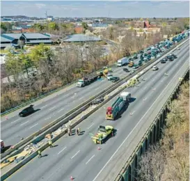  ?? STAFF ?? Emergency personnel work at the scene of fatal crash along Interstate 695 near Woodlawn on March 22, 2023. Six constructi­on workers were killed in the crash that closed the Baltimore Beltway in both directions, snarling traffic along the west side of the highway that encircles the city.