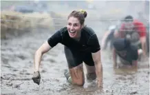  ?? Epic Action Pictures/the Canadian Press ?? Obstacle course racing events are reminiscen­t of childhood play, foster a sense of camaraderi­e and can boost self confidence.