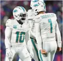  ?? ADRIAN KRAUS/AP ?? Miami Dolphins wide receiver Tyreek Hill (10) celebrates a touchdown with quarterbac­k Tua Tagovailoa during the second half of a Dec. 17 game against the Buffalo Bills in Orchard Park, New York.