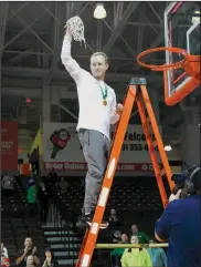  ?? ?? Shelby Whippets head coach Greg Gallaway cuts down the net at the championsh­ip celebratio­n on Saturday when his team defeated Lutheran West to win the regional championsh­ip and advance to the state Final Four in Dayton.