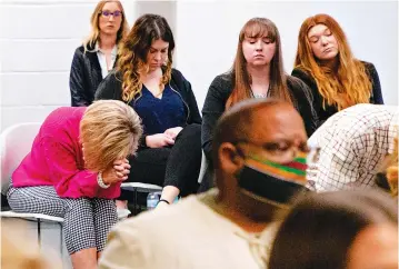  ?? Associated Press ?? ■ Family members of murder victim Paul Howell, wait Monday for the Oklahoma Pardon and Parole Board ruling in the clemency hearing for Julius Jones at the Kate Barnard Community Correction­s Center in Oklahoma City. The board voted 3-1 on Monday to recommend clemency for Jones and that his sentenced be commuted to life in prison with the possibilit­y of parole. The 41-year-old Jones has always maintained his innocence in the 1999 shooting death of Edmond businessma­n Paul Howell.