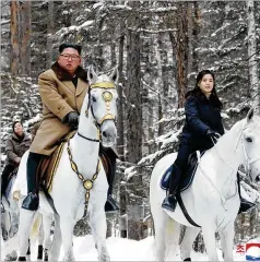  ?? KOREAN CENTRAL NEWS AGENCY VIA THE NEW YORK TIMES ?? North Korean leader Kim Jong Un and his wife, Ri Sol Ju, ride white horses on a visit to Mount Paektu.