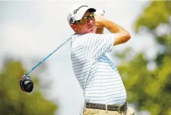  ?? AP PHOTO/ALEX SLITZ ?? Jim Herman tees off on the 10th hole during the third round of the Barbasol Championsh­ip on Saturday at Keene Trace Golf Club in Nicholasvi­lle, Kentucky. Herman shot a 62.