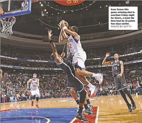  ??  ?? Evan Turner hits game-winning shot in overtime Friday night for Sixers, a team the Nets beat by 36 points four days earlier.