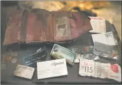  ?? DAMON WINTER NEW YORK TIMES ?? The wallet of Giovanna Gambale, who died on 9/11, on display at the museum.