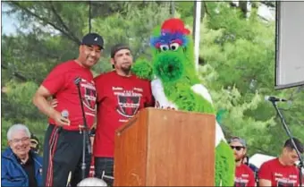  ??  ?? CBS3’s Ukee Washington, U.S. Marine Corps Staff Sgt. Brian Siegman and the Phillie Phanatic join together on stage at the 2016 Walk for the Wounded. The event returns Rose Tree Park on Saturday, May 20. to