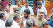  ?? HT PHOTO ?? Subcollect­or Sriram (spectacles) at a demolition drive in Munnar in Kerala.