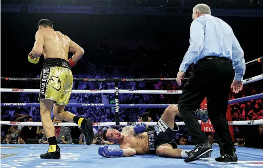  ?? Photo: MIKEY WILLIAMS/TOP RANK ?? TOO EASY: Alimkhanul­y breaks down Butler without breaking a sweat in the process