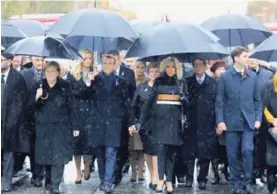  ?? AFP ?? El presidente de Francia, Emmanuel Macron, y la canciller alemana, Ángela Merkel, a su llegada al Arco del Triunfo, en París.