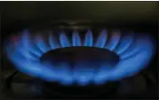  ?? RICHARD VOGEL — THE ASSOCIATED PRESS ?? A gas-lit flame burns on a natural gas stove on Tuesday.