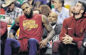  ?? AP PHOTO ?? Cleveland Cavaliers’ LeBron James, left, and Kevin Love sit on the bench during the second half of Tuesday’s NBA playoff game in Boston.