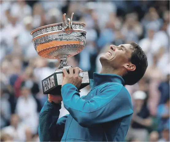  ?? EPA ?? Rafael Nadal joins Margaret Court as the only player to claim 11 titles at the same major after winning another French Open trophy