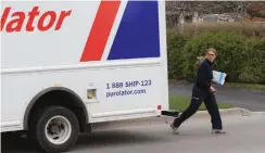  ?? RENÉ JOHNSTON TORONTO STAR FILE PHOTO ?? Purolator expects to deliver a record 46 million packages through its peak season this year, which runs from November into December.