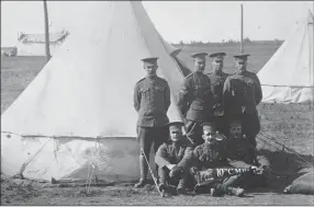  ?? The Canadian Press ?? Charles Chapman, above, middle of the back row with his fellow soldiers, is shown in this undated handout photo. George Vowel and his wife Laura Knutson are shown in this undated handout photo, left.