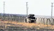  ?? AP ?? A Turkish army vehicle is seen in the village of Alakamis, in southeaste­rn Turkey, after returning from a joint patrol with Russian forces on Friday.