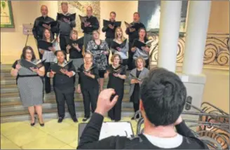  ?? JIM WITMER / STAFF ?? The singing group called Musica performs in the lobby of the Dayton Art Museum during the Power2Give launch event in Dayton. Power2Give will help provide funding for arts-related projects in the area. Musica is one such organizati­on. They are...