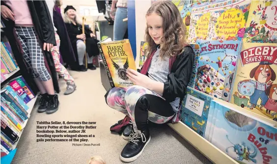  ?? Picture / Dean Purcell ?? Tabitha Sellar, 8, devours the new Harry Potter at the Dorothy Butler bookshop. Below, author JK Rowling sports winged shoes at a gala performanc­e of the play.