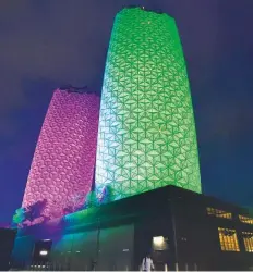  ?? Ahmed Kutty/Gulf News ?? Pineapple tower on Eastern Ring Road lit up for the occasion.