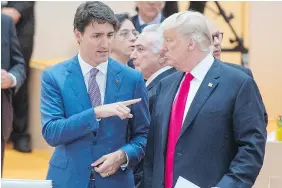  ?? — THE CANADIAN PRESS ?? Justin Trudeau and Donald Trump discussed their difference­s over softwood lumber and steel imports on the G20 summit sidelines on Saturday in Hamburg.