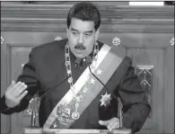  ?? AP/ ARIANA CUBILLOS ?? Venezuela’s President Nicolas Maduro addresses constituti­onal assembly members during a special session Thursday at the National Assembly building in Caracas. In his remarks, Maduro said he wants a stronger relationsh­ip with the United States.