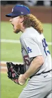  ??  ?? DUSTIN MAY yells with approval after Joc Pederson’s catch in the seventh inning.