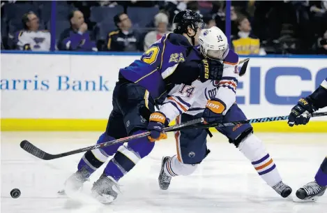  ?? J e f f Ro b e r s o n/ T h e Ass o c i at e d P r e ss ?? Edmonton Oilers’ Jordan Eberle, right, who injured his knee against the Nashville Predators on Tuesday, didn’t play Thursday against Buffalo but could be back in the lineup for Saturday night’s game against the Calgary Flames.