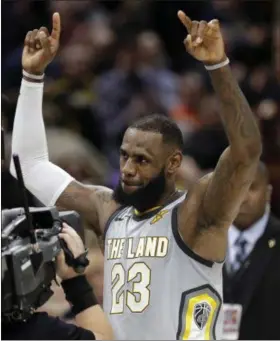  ?? TONY DEJAK —ASSOCIATED PRESS ?? LeBron James celebrates after making the game-winning basket in overtime against the Timberwolv­es on Feb. 7.