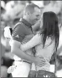  ?? AP/DAVID GOLDMAN ?? Sergio Garcia and his fiancee Angela Atkins celebrate after Garcia won the Masters on Sunday. The victory was the first major championsh­ip for Garcia.