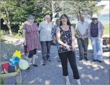  ?? ?? Amanda Duffy Brown cut the ribbon at Minard’s Jubilee Garden opening.