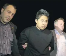  ?? GLOBAL TELEVISION CALGARY ?? Wilson Clorina is arrested in May 2013 and charged with second- degree murder in connection with the stabbing deaths of Chona Manzano, 35, and her five- year- old son, Gabrial.