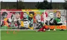  ?? Powell/Liverpool FC/Getty Images ?? Caoimhín Kelleher trains in front of the goalkeeper mural at Liverpool training centre last November. Photograph: Andrew