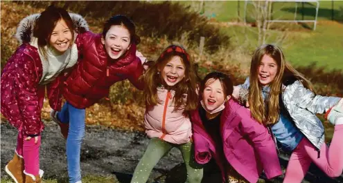  ?? ?? Group of happy students play together at New Canaan Country School. Photo contribute­d by Meaghan Mallin.