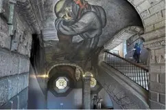  ?? ?? a mural by Jose Clemente Orozco titled, Franciscan­s and depicting a friar embracing an Indigenous man, adorns the ceiling, vault and side of a stairwell, inside the former Jesuit college antiguo Colegio de San Ildefonso.
