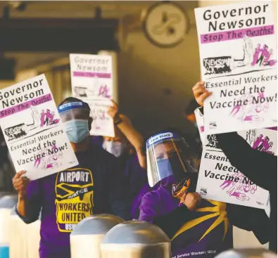  ?? PATRICK T. FALLON / AFP VIA GETTY IMAGES FILES ?? Airport workers with the Service Employees Internatio­nal Union protest in Los Angeles recently and call on California Governor Gavin Newsom to support vaccine priority for essential workers in the COVID-19 pandemic.