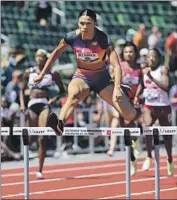  ?? Andy Lyons Getty Images ?? SYDNEY McLAUGHLIN set a world record with 51.41 seconds in the 400-meter hurdles.