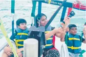  ?? The Haggard Law Firm ?? Supraja Alaparthi, center, died in a parasailin­g tragedy after a boat captain cut the cable on May 30, according to authoritie­s. Her son, left, and nephew survived.