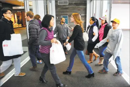  ?? Hearst Connecticu­t Media file photos ?? Shoppers look for Black Friday deals at theWestfie­ld Trumbull mall in 2016. Operators of theWestfie­ld Trumbull mall say they are looking to step away from their retailonly foundation to boost foot traffic.