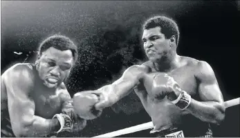  ?? Picture: Associated Press ?? THRILLA IN MANILA: Muhammad Ali connects Joe Frazier, left, with a right in the ninth round of their title fight in Manila, Philippine­s, in 1975. Ali won the fight on a technical KO to retain the title.