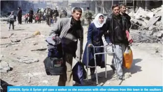  ?? — AFP ?? JISREEN, Syria: A Syrian girl uses a walker as she evacuates with other civilians from this town in the southern Eastern Ghouta on the way to areas under government control yesterday.